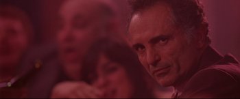 Movie still from “Donnie Brasco” (1997), directed by Mike Newell – A man's face in a room; Close Up shot, Low angle