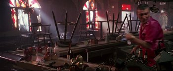 Movie still from “Donnie Brasco” (1997), directed by Mike Newell – A table with a bunch of plates and cups on top of it; Medium shot, High angle