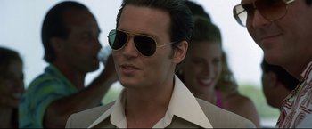 Movie still from “Donnie Brasco” (1997), directed by Mike Newell – A person wearing sunglasses; Close Up shot, Low angle