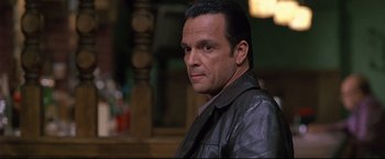 Movie still from “Donnie Brasco” (1997), directed by Mike Newell – A person wearing a leather jacket; Close Up shot, Low angle