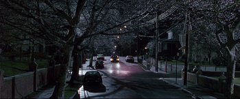 Movie still from “Donnie Brasco” (1997), directed by Mike Newell – Cars are driving down a street at night; Extreme Wide shot, High angle
