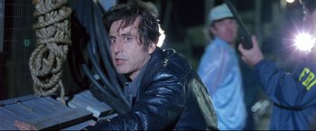 Movie still from “Donnie Brasco” (1997), directed by Mike Newell – A person wearing a leather jacket; Close Up shot, Low angle