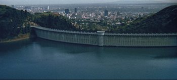 Movie still from “Earthquake” (1974), directed by Mark Robson – A view of a city from a hill overlooking a body of water; Extreme Wide shot, High angle