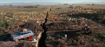 Movie still from “Earthquake” (1974), directed by Mark Robson – An aerial view of an area that has been destroyed by a landslide; Extreme Wide shot, Overhead angle