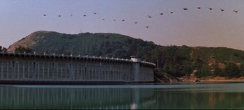 Movie still from “Earthquake” (1974), directed by Mark Robson – A body of water near a body of water; Extreme Wide shot, High angle