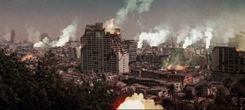 Movie still from “Earthquake” (1974), directed by Mark Robson – An aerial view of a city with a fire in the background; Extreme Wide shot, High angle