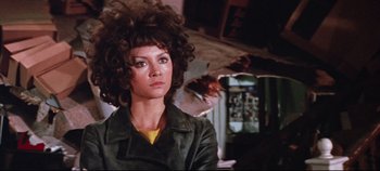 Movie still from “Earthquake” (1974), directed by Mark Robson – A person wearing a leather jacket; Close Up shot, Low angle