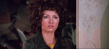 Movie still from “Earthquake” (1974), directed by Mark Robson – A person wearing a jacket; Close Up shot, Low angle