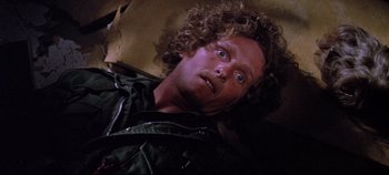 Movie still from “Earthquake” (1974), directed by Mark Robson – A person laying on the ground; Close Up shot, High angle