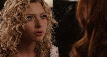 Movie still from “Easy A” (2010), directed by Will Gluck – A person with curly hair; Close Up shot, Over the shoulder angle