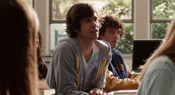 Movie still from “Easy A” (2010), directed by Will Gluck – A group of young men sitting next to each other in a room; Close Up shot, Over the shoulder angle