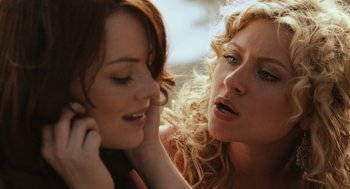 Movie still from “Easy A” (2010), directed by Will Gluck – Two beautiful young women standing next to each other; Close Up shot, Over the shoulder angle
