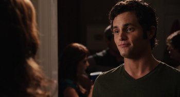 Movie still from “Easy A” (2010), directed by Will Gluck – A man standing in front of a woman in front of a mirror; Close Up shot, Over the shoulder angle