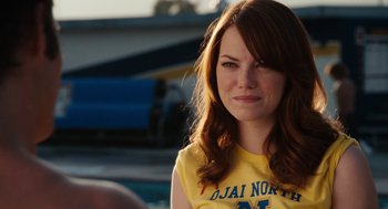 Movie still from “Easy A” (2010), directed by Will Gluck – A person with long red hair; Close Up shot, Over the shoulder angle