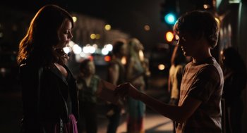 Movie still from “Easy A” (2010), directed by Will Gluck – Two people shaking hands on the side of the street; Medium shot, Over the shoulder angle