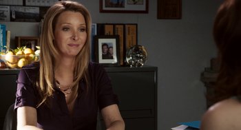 Movie still from “Easy A” (2010), directed by Will Gluck – A woman sitting at a desk in front of a computer monitor; Close Up shot, Over the shoulder angle