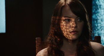Movie still from “Easy A” (2010), directed by Will Gluck – A beautiful young woman with long brown hair; Close Up shot, Over the shoulder angle