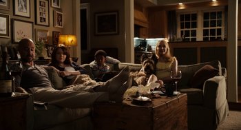 Movie still from “Easy A” (2010), directed by Will Gluck – A group of people sitting on top of couches; Wide shot, High angle