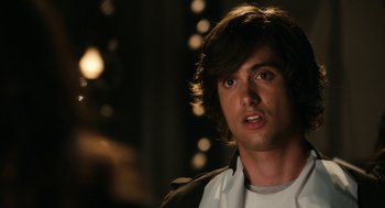 Movie still from “Easy A” (2010), directed by Will Gluck – A person wearing a white shirt; Close Up shot, Over the shoulder angle