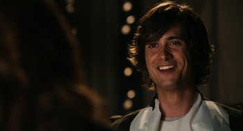 Movie still from “Easy A” (2010), directed by Will Gluck – A person smiling for the camera; Close Up shot, Over the shoulder angle