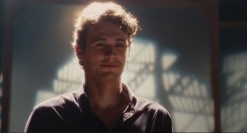 Movie still from “Eat Pray Love” (2010), directed by Ryan Murphy – A person wearing a black shirt; Close Up shot, Over the shoulder angle