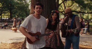 Movie still from “Eat Pray Love” (2010), directed by Ryan Murphy – A group of people standing next to each other; Medium shot, Over the shoulder angle