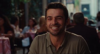 Movie still from “Eat Pray Love” (2010), directed by Ryan Murphy – A person smiling at the camera; Close Up shot, Over the shoulder angle