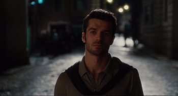 Movie still from “Eat Pray Love” (2010), directed by Ryan Murphy – A person wearing a shirt; Close Up shot, Over the shoulder angle