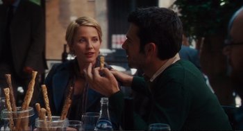 Movie still from “Eat Pray Love” (2010), directed by Ryan Murphy – A man and a woman sitting at a table; Medium shot, Over the shoulder angle