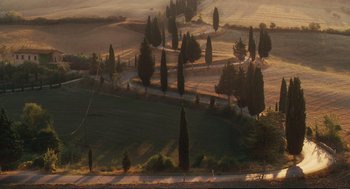 Movie still from “Eat Pray Love” (2010), directed by Ryan Murphy – A view of a field with trees in the background; Extreme Wide shot, High angle