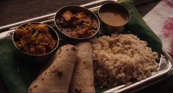 Movie still from “Eat Pray Love” (2010), directed by Ryan Murphy – A tray with rice , curry , and a burrito; Extreme Close Up shot, Overhead angle