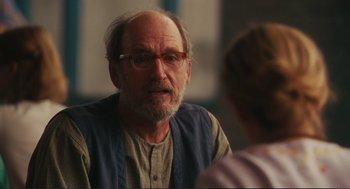 Movie still from “Eat Pray Love” (2010), directed by Ryan Murphy – An older man wearing glasses talking to a younger woman; Close Up shot, Over the shoulder angle