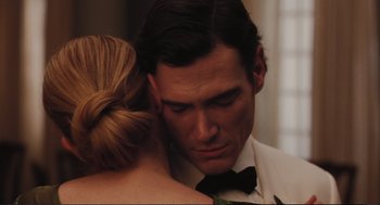 Movie still from “Eat Pray Love” (2010), directed by Ryan Murphy – A person wearing a suit and a bow tie; Close Up shot, Over the shoulder angle