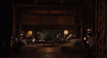 Movie still from “Eat Pray Love” (2010), directed by Ryan Murphy – A living room filled with couches and a table; Extreme Wide shot, High angle