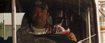 Movie still from “Fast & Furious” (2009), directed by Justin Lin – A man sitting in the driver's seat of a car; Close Up shot, Over the shoulder angle