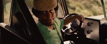 Movie still from “Fast & Furious” (2009), directed by Justin Lin – A man wearing a hat sitting in the driver's seat of a truck; Close Up shot, Over the shoulder angle