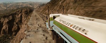 Movie still from “Fast & Furious” (2009), directed by Justin Lin – A truck driving down the side of a road; Extreme Wide shot, High angle