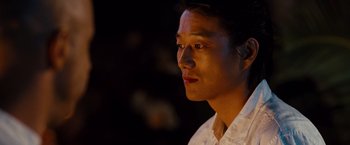 Movie still from “Fast & Furious” (2009), directed by Justin Lin – A person wearing a white shirt; Close Up shot, Over the shoulder angle