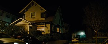 Movie still from “Fast & Furious” (2009), directed by Justin Lin – A night time picture of a house with a car parked on the side of the road; Extreme Wide shot, Low angle