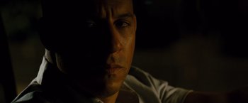 Movie still from “Fast & Furious” (2009), directed by Justin Lin – A man's face in the dark; Close Up shot, High angle