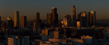 Movie still from “Fast & Furious” (2009), directed by Justin Lin – A view of a city at sunset from a hill; Extreme Wide shot, High angle