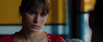 Movie still from “Fast & Furious” (2009), directed by Justin Lin – A person wearing a red shirt; Close Up shot, Over the shoulder angle