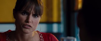 Movie still from “Fast & Furious” (2009), directed by Justin Lin – A person wearing a red shirt; Close Up shot, Over the shoulder angle