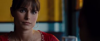 Movie still from “Fast & Furious” (2009), directed by Justin Lin – A person wearing a red shirt; Close Up shot, Over the shoulder angle