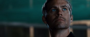 Movie still from “Fast & Furious” (2009), directed by Justin Lin – A person with blue eyes; Close Up shot, Over the shoulder angle
