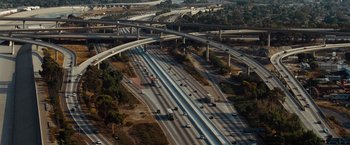 Movie still from “Fast & Furious” (2009), directed by Justin Lin – An aerial view of a freeway with many cars on it; Extreme Wide shot, High angle