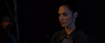 Movie still from “Fast & Furious” (2009), directed by Justin Lin – A beautiful woman in a black jacket looking to her left; Close Up shot, Over the shoulder angle