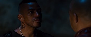 Movie still from “Fast & Furious” (2009), directed by Justin Lin – A man's face in the dark; Close Up shot, Over the shoulder angle