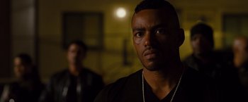 Movie still from “Fast & Furious” (2009), directed by Justin Lin – A person wearing a black shirt; Close Up shot, Over the shoulder angle