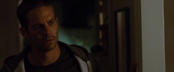 Movie still from “Fast & Furious” (2009), directed by Justin Lin – A person sitting in a chair; Close Up shot, Over the shoulder angle